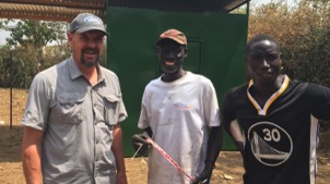 Brian Dyck working with people from Uganda to build the walking tractor.